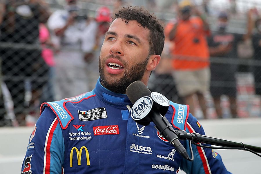  In this file photo taken on June 22, 2020 Bubba Wallace, driver of the #43 Victory Junction Chevrolet, speaks to the media after the NASCAR Cup Series GEICO 500 at Talladega Superspeedway in Talladega, Alabama. - NASCAR president Steve Phelps said on June 25, 2020 that the noose found in the garage of Bubba Wallace "was real" and while the series' only black driver wasn't targeted in a hate crime, officials' concern for him was warranted. Credit/AFP Photo