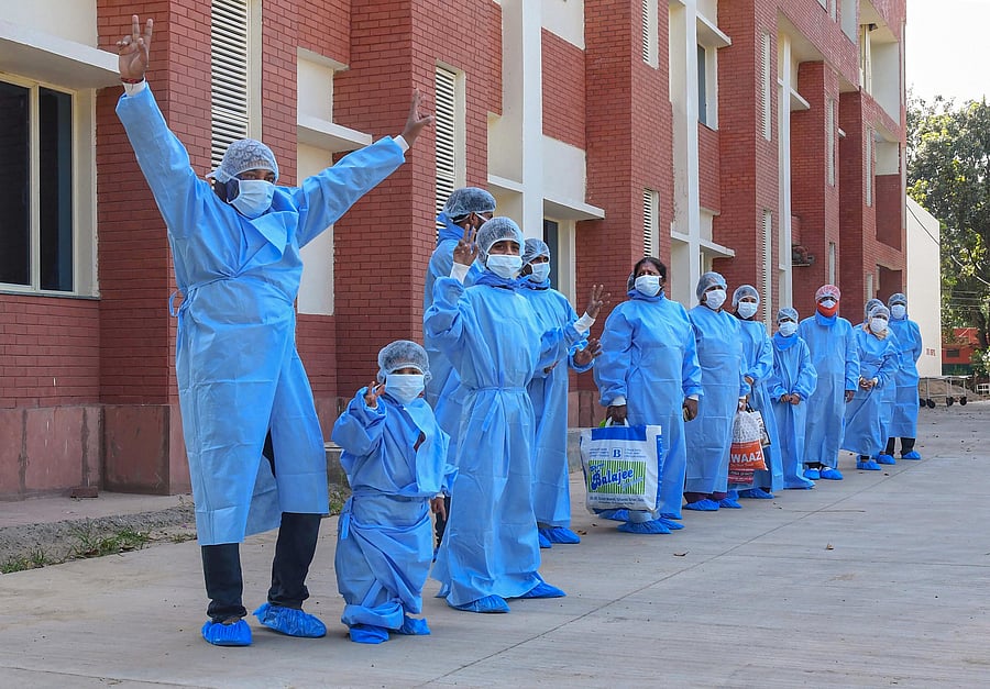 Patients who recovered from Covid-19 pose for photographs after being discharged from PGIMER’s hospital, during the ongoing lockdown to curb the spread of coronavirus disease, in Chandigarh. (PTI Photo)
