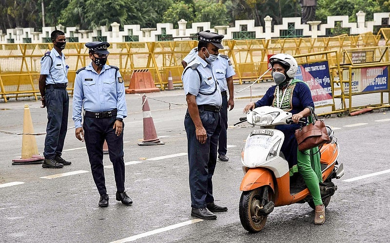 Security personnel stop a commuter during a total lockdown imposed by the Assam Government to contain the spread of coronavirus. Credits: PTI Photo