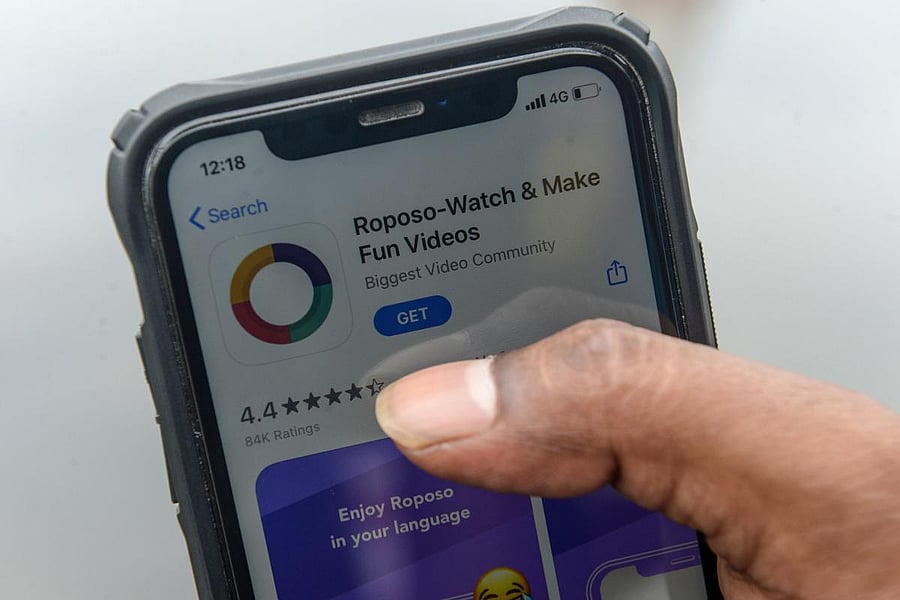 A man browses on an online store the Indian app platform Roposo (AFP Photo)