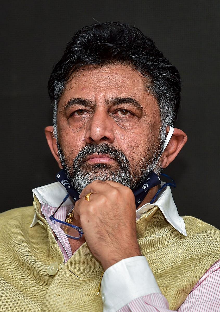 Bengaluru: KPCC President D K Shivakumar looks on as Rajyasabha MP & Senior Congress leader Mallikarjun Kharge (unseen) addresses a press conference, at KPCC office in Bengaluru, Monday, June 22, 2020. Credit: PTI