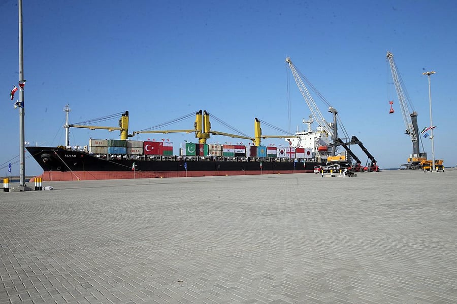 A handout picture provided by the office of Iranian President Hassan Rouhani shows a ship bearing various flags parked at Chabahar Port during the inauguraition of the first phase in the southern Iranian coastal city of Chabahar. Credit: AFP/Iranian Presidency/File