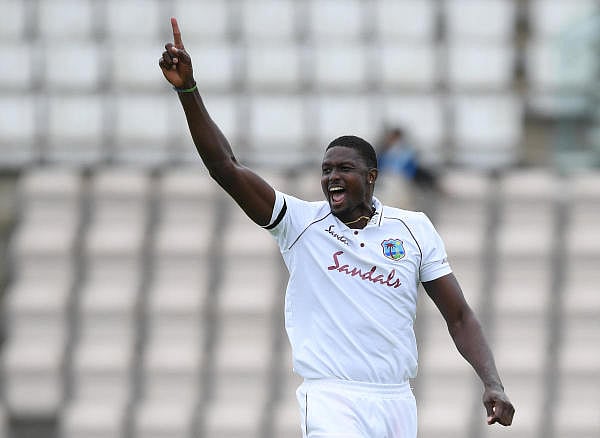 West Indies' Jason Holder celebrates taking the wicket of England's Jos Buttler, as play resumes behind closed doors following the outbreak of the coronavirus. Credit: Reuters Photo