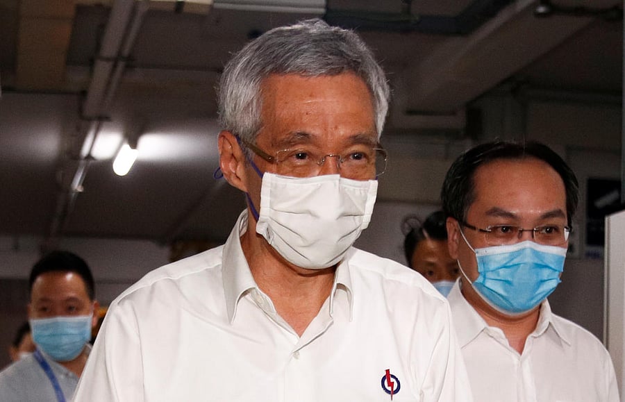 Singapore's Prime Minister Lee Hsien Loong arrives at a People's Action Party branch office, as ballots are being counted during the general election, in Singapore. Credit: Reuters