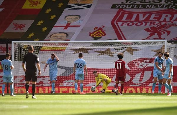Burnley's English goalkeeper Nick Pope makjes a save from Liverpool's Egyptian midfielder Mohamed Salah during the English Premier League football match between Liverpool and Burnley at Anfield in Liverpool, north west England on July 11, 2020. Credit: AFP Photo