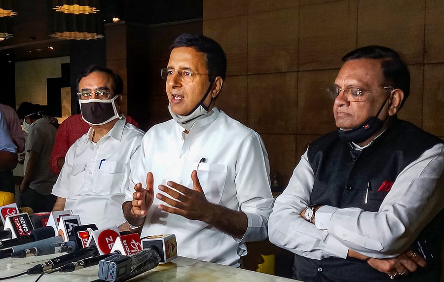  Congress leaders Randeep Surjewala, Ajay Maken (L) and Avinash Pandey (R) address the media in Jaipur. Credits: PTI Photo
