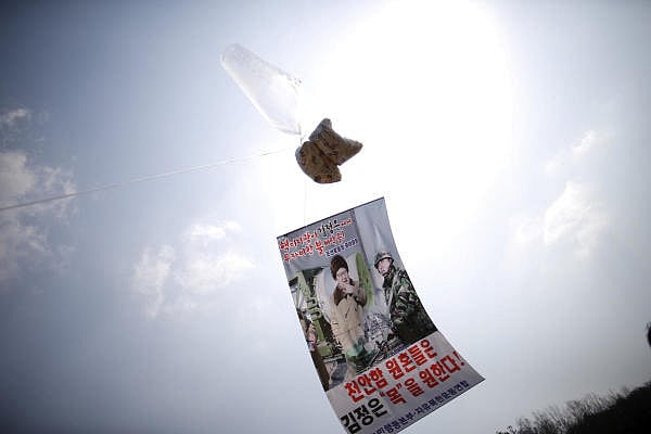 Old image of a balloon containing leaflets denouncing North Korean leader Kim Jong Un, to be floated over North Korea, is seen near the demilitarized zone separating the two Koreas in Paju, South Korea. Credit: Reuters Photo