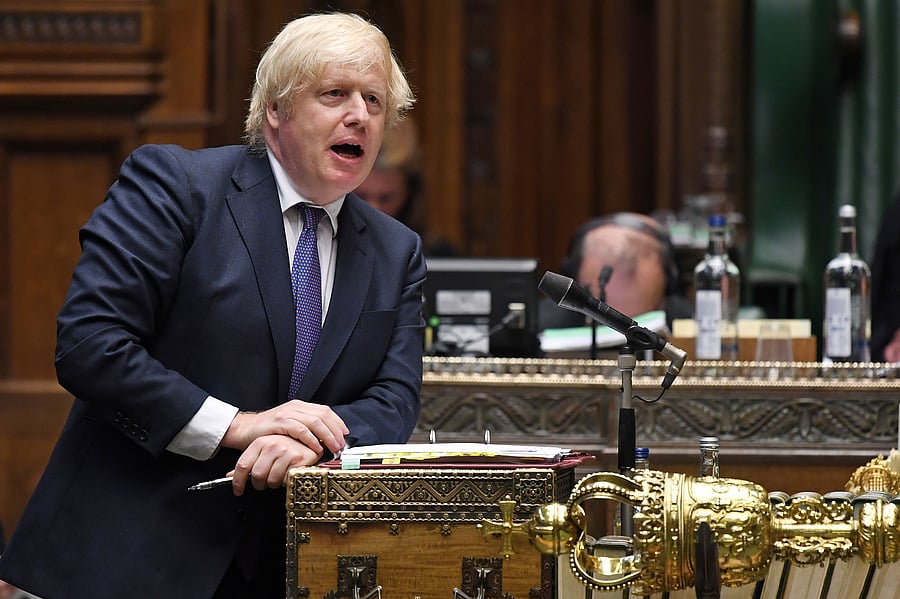 A handout photograph released by the UK Parliament shows Britain's Prime Minister Boris Johnson speaking during Prime Minister's Questions (PMQs) in the House of Commons in London on July 1, 2020. - Britain on Wednesday extended Hong Kong residents a broader path to citizenship in response to China's sweeping new security law for the former UK territory. Prime Minister Boris Johnson's announcement represents the most direct international response to legislation that has been roundly condemned by Western allies. Credit: AFP