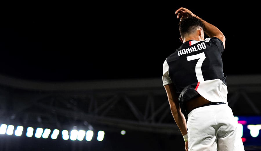 Juventus' Portuguese forward Cristiano Ronaldo celebrates after scoring the first goal during the Italian Serie A football match between Juventus and Lazio. Credit: AFP Photo