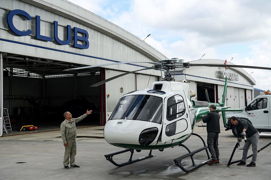 Workers prepare a helicopter for a flight at Heli Club outside Moscow. Credit: AFP