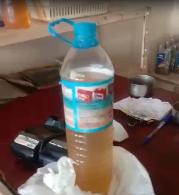 Bottle filled with petro-water blend. Credit: DH Photo