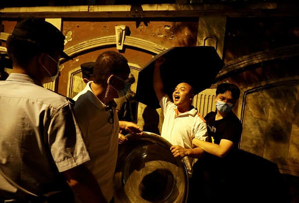 A protester shouts pro-China slogans outside the US Consulate General in Chengdu, Sichuan province, China. Credit: Reuters