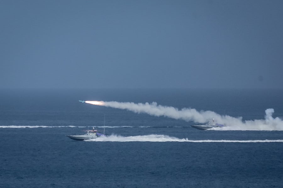 This handout photo provided by Iran's Revolutionary Guard Corps shows a missile being fired from a boat during a military exercise near the Strait of Hormuz. Credit: AFP Photo