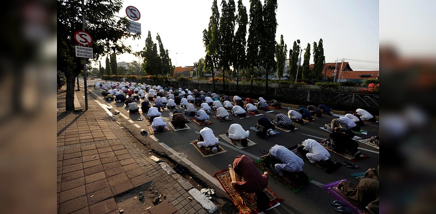 Indonesian Muslims offer Eid al-Adha prayers on the street in Jakarta, during the outbreak of the coronavirus disease. Credit: Reuters