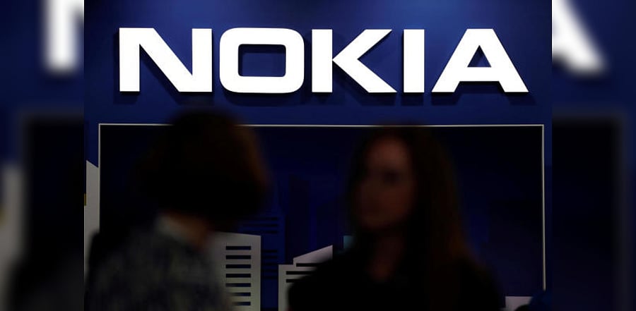 Visitors gather outside the Nokia booth at the Mobile World Congress in Barcelona. Credit: Reuters Photo