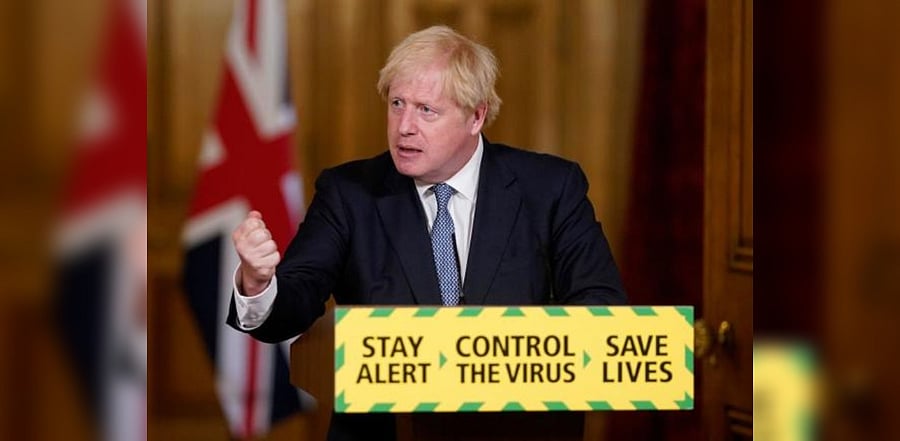 Britain's Prime Minister Boris Johnson attending a remote press conference. Credit: AFP Photo