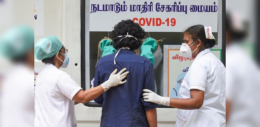 A health worker collects a sample of a specially-abled patient at Institute of Mental Health for Covid-19 test, in Chennai. Credit: PTI Photo