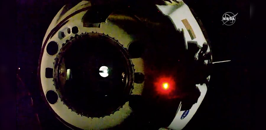 In this image from video made available by NASA, the SpaceX Crew Dragon capsule separates from the International Space Station. Credit: AP Photo