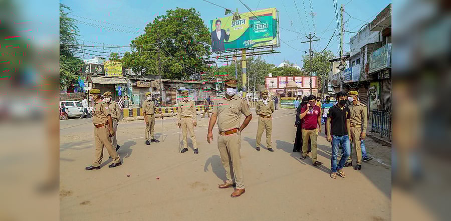 Police personnel stand guard on a street on Eid al-Adha during the complete lockdown on weekend to curb the spread of coronavirus. Credits: PTI Photo