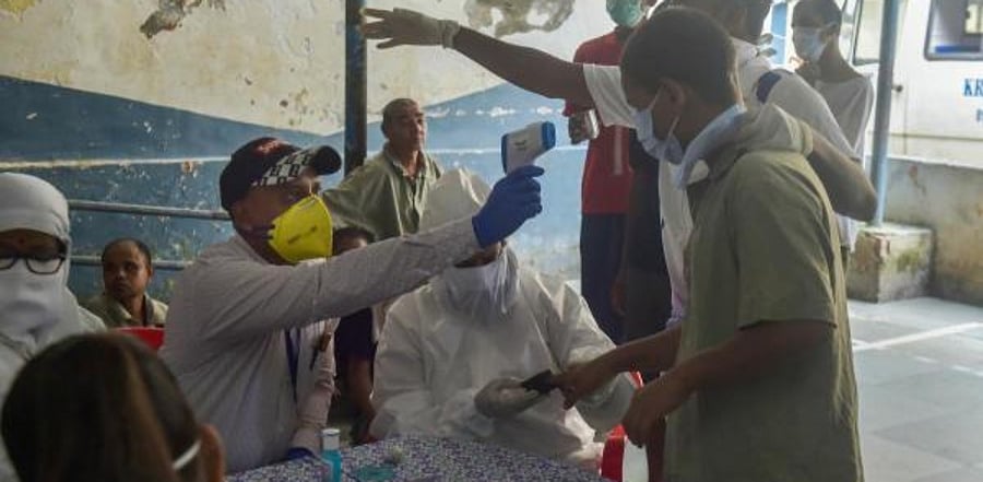  Health workers conduct Covid-19 testing of specially-abled children in Mumbai. Credit: PTI Photo