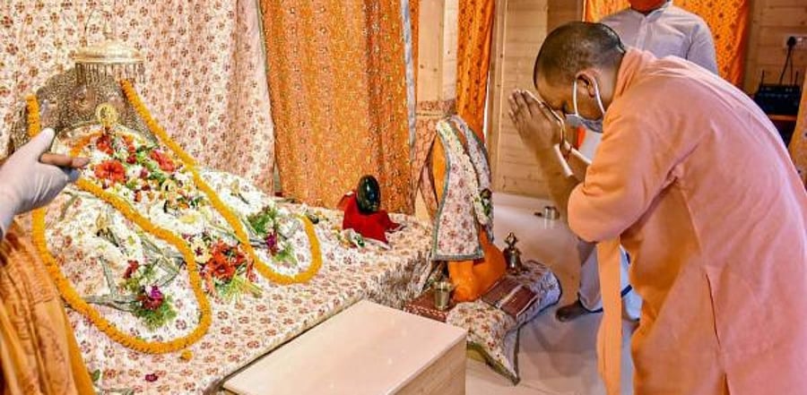 Uttar Pradesh Chief Minister Yogi Adityanath offers prayers to Lord Ram during his visit to Ram Janmabhoomi premises to take stock of preparedness for the ground breaking ceremony of the Ram Mandir, in Ayodhya. Credit: PTI