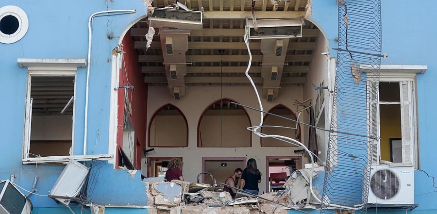 Ceilings collapsed, walls and windows were blown out and debris was found far as two miles from the port. Cars were flipped, and rubble from shattered buildings filled city streets. Credit: AFP