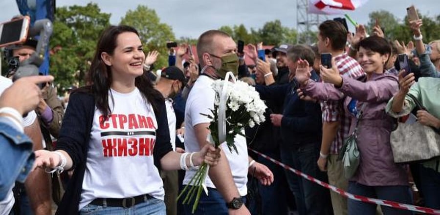 Presidential candidate Svetlana Tikhanovskaya leaves after her campaign rally in the town of Maladzechna, some 70 km northwest of Minsk. Credit: AFP