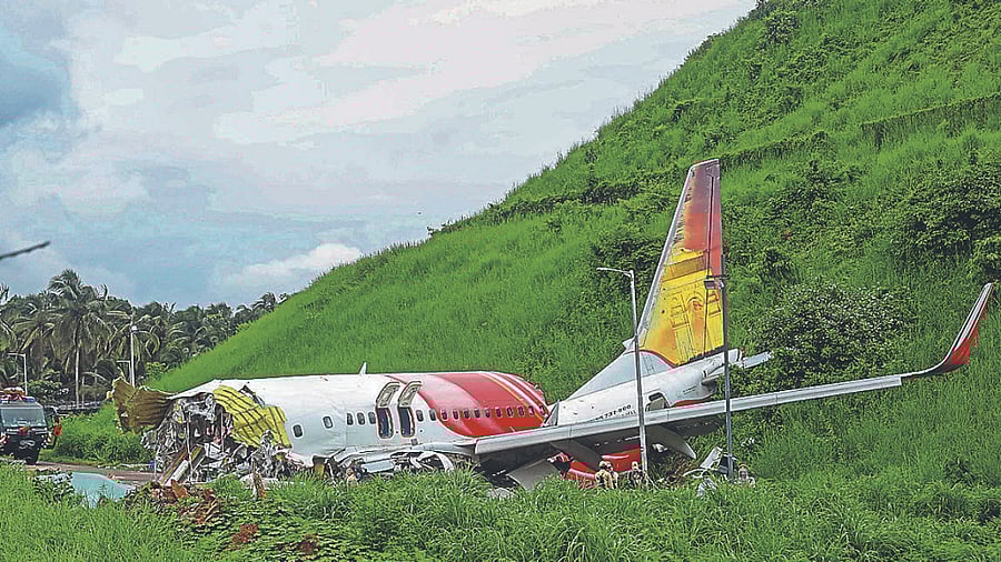 Mangled remains of an Air India Express flight, en route from Dubai, after it skidded off the runway while landing on Friday night. Credits: PTI Photo