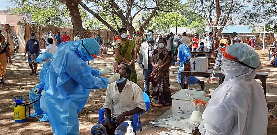 Health workers take samples from people for Covid-19 tests, at a camp at Koodapakam village in Puducherry, Friday, July 31, 2020. Credit: PTI Photo
