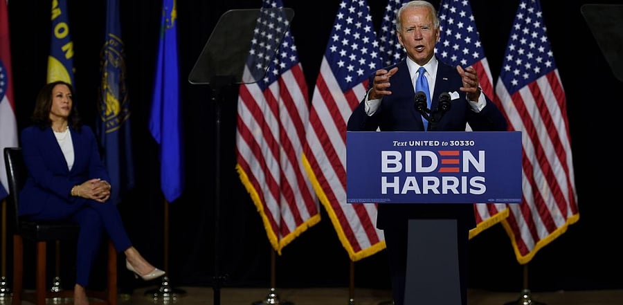 Democratic presidential nominee and former US Vice President Joe Biden speaks as his vice presidential running mate, US Senator Kamala Harris, listens during their first press conference together in Wilmington, Delaware. Credit: AFP Photo