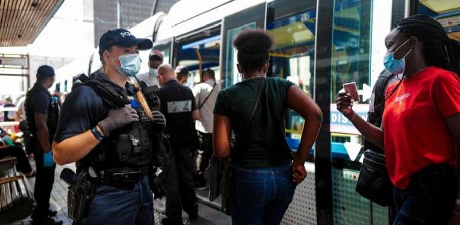 People wear masks at the metro. Credit: AFP