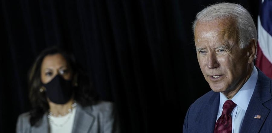 Presumptive Democratic vice presidential nominee, US Sen. Kamala Harris listens as presumptive Democratic presidential nominee former Vice President Joe Biden. Credit: AFP Photo