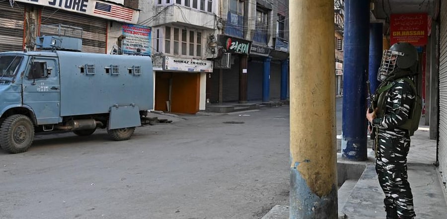 Indian paramilitary personnel stand guard along a street as India celebrates its 74th Independence Day in Srinagar on August 15, 2020. Credit: AFP Photo
