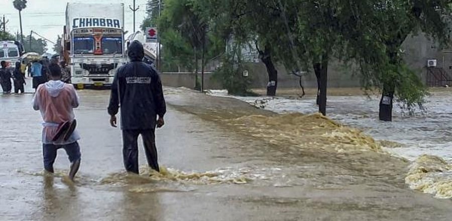 National Highway 26 is seen inundated due to flash floods after incessant monsoon rains, in Balangir district of Odisha. Credit: PTI photo