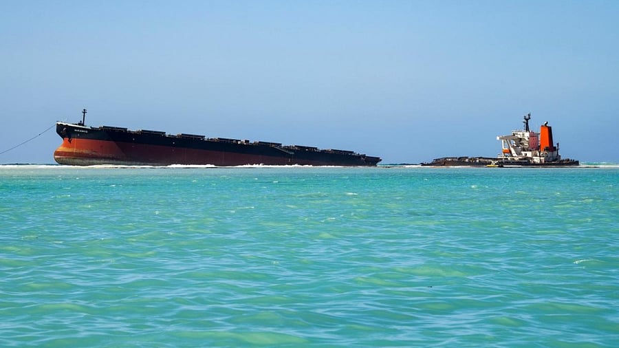 A picture taken on August 16, 2020 shows agrounded vessel MV Wakashio, belonging to a Japanese company but Panamanian-flagged, near Blue Bay Marine Park. Credit: AFP