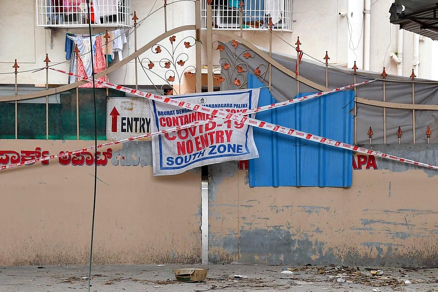 A apartment building at Marenahalli sealed down due to Covid-19 in Bengaluru on Sunday. DH Photo/Pushkar V