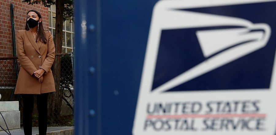 U.S. House Representative Alexandria Ocasio-Cortez (D-NY) stands during a news conference about the United States Postal Service. Credit: Reuters Photo