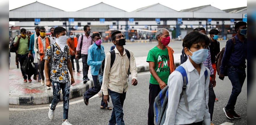 Migrant workers, who returned to Delhi from their native state arrive for a rapid antigen test, at a bus terminal, amidst the coronavirus disease (COVID-19) outbreak in New Delhi, India, August 17, 2020. Credit: Reuters Photo