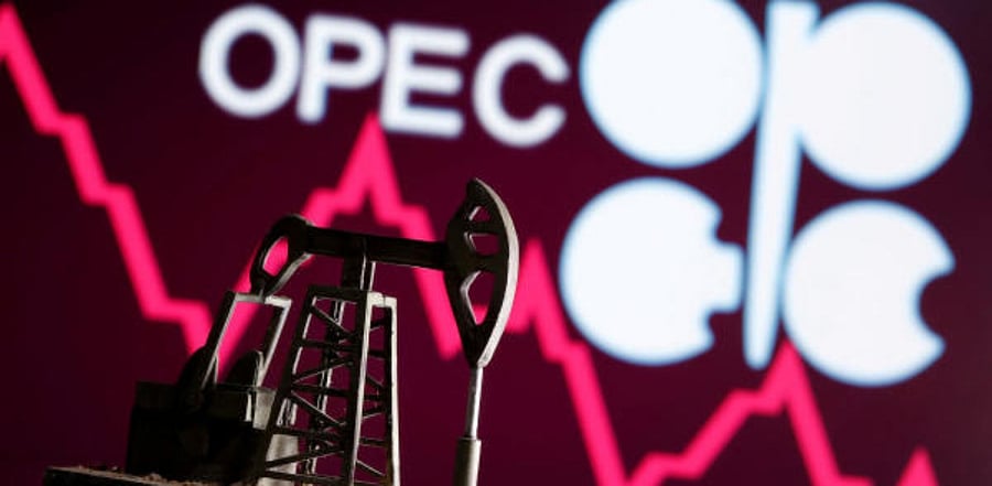 A 3D printed oil pump jack is seen in front of displayed stock graph and Opec logo. Representative Image. Credit: Reuters