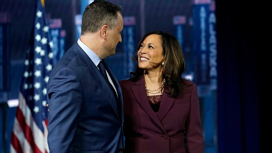 Democratic vice presidential candidate Sen. Kamala Harris, D-Calif., is joined on stage by her husband Doug Emhoff after she spoke during the third day of the Democratic National Convention. Credits: AP Photo