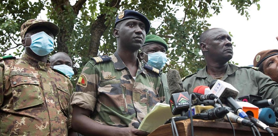 Colonel Assimi Goita (C) speaks to the press in Kati on August 19, 2020, a day after the military arrested Malian president Ibrahim Boubacar Keita and he officially resigned. Credit: AFP Photo