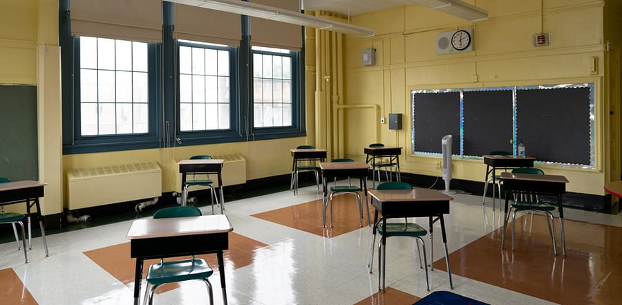 Students' desk adhere to social distancing requirements in a classroom during a news conference at New Bridges Elementary School, ahead of schools reopening, in the Brooklyn