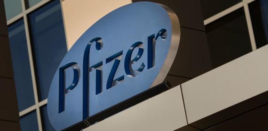 a sign for Pfizer pharmaceutical company. Credit: AFP