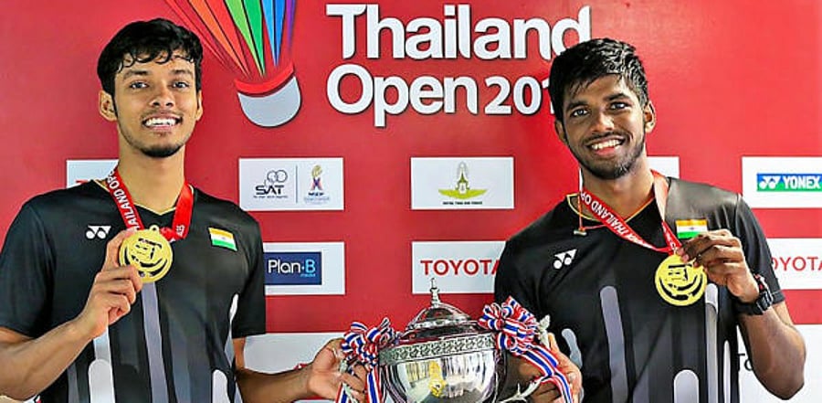 India’s Satwiksairaj Rankireddy and Chirag Shetty pose with their medals and trophy after winning the Thailand Open 2019 badminton doubles title in Bangkok. Credit: PTI Photo