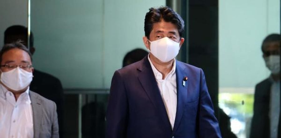 Japan's Prime Minister Shinzo Abe (C) in Tokyo. Credit: AFP