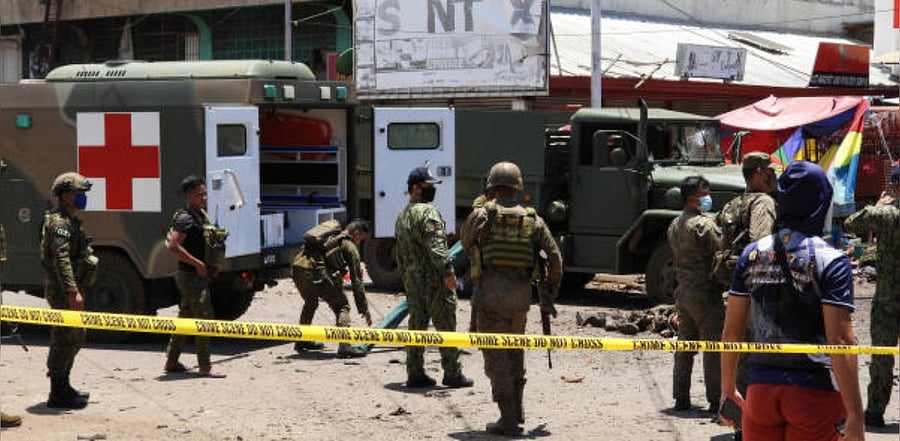 Filipino soldiers are pictured on the site of an explosion in Jolo Island, Sulu province, Philippines. Credit: Reuters Photo