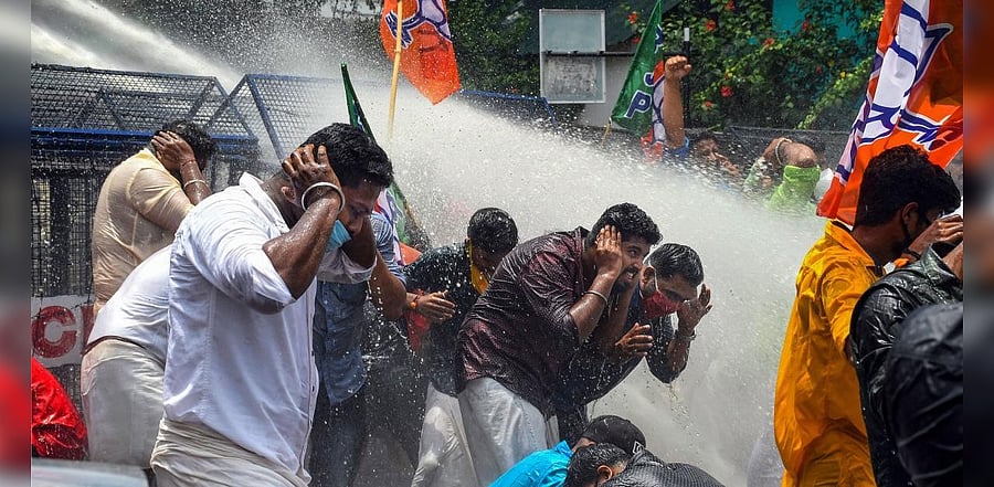 Police use water cannons to disperse angry protestors. Credit: PTI Photo