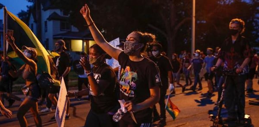 Protesters march during a demonstration against the shooting of Jacob Blake in Kenosha, Wisconsin. Credit: AFP