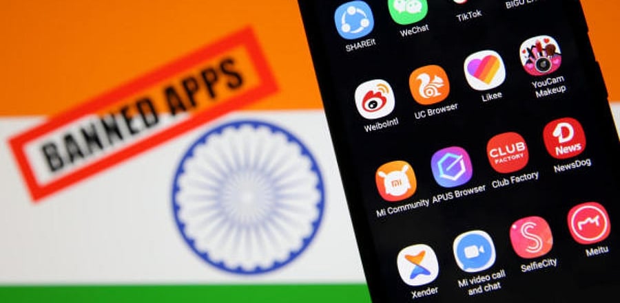 Smartphone with Chinese applications is seen in front of a displayed Indian flag. Credit: Reuters