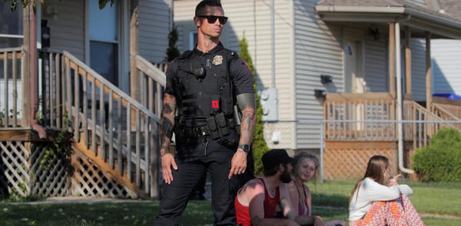 Law enforcement officials detain protesters during a traffic stop, following the police shooting of Jacob Blake, a Black man, in Kenosha, Wisconsin. Credit: Reuters Photo